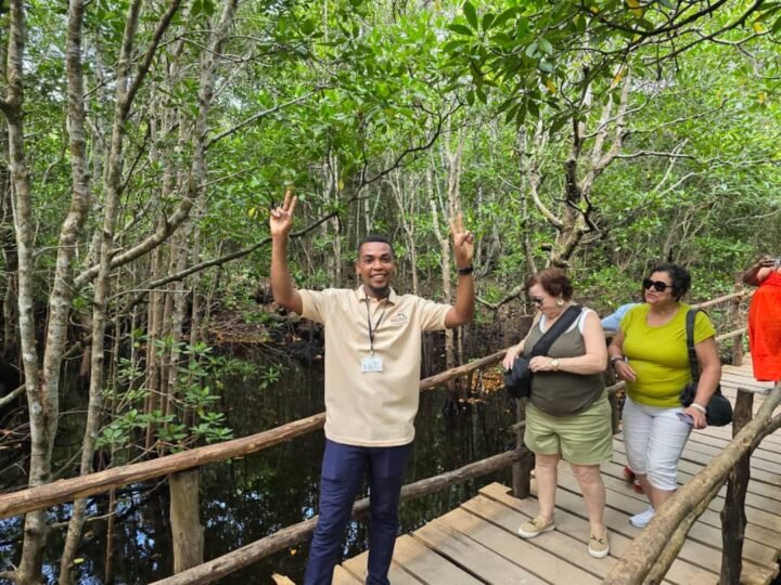 Guide explaining the forest to visitors in Jozani, Zanzibar