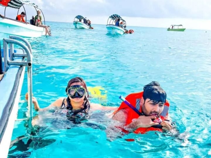 Snorkelling in clear water at the Mnemba atoll, Zanzibar