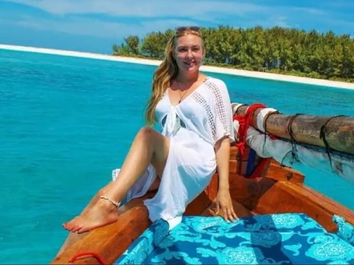 Traditional dhow on turquoise water near Mnemba, Zanzibar